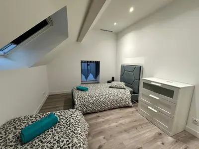 Un ou plusieurs lits dans un hébergement de l'établissement Comme a la maison 6