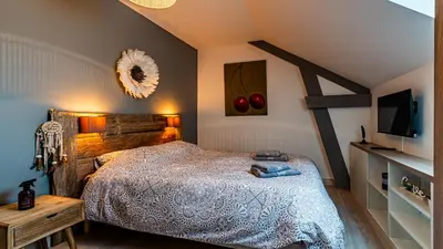 Un ou plusieurs lits dans un hébergement de l'établissement La Maison d'Ernest - Climatisée - Circuit DIJON PRENOIS