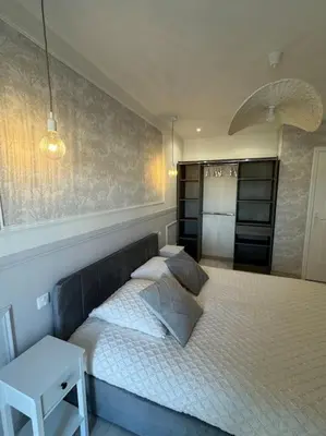 Un ou plusieurs lits dans un hébergement de l'établissement Appartement avec magnifique vue sur la Saône et son balcon
