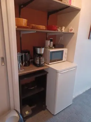 Cuisine ou kitchenette dans l'établissement Chambre calme et agréable