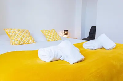 Un ou plusieurs lits dans un hébergement de l'établissement La Pause Péronnaise - Maison de ville en coeur de village
