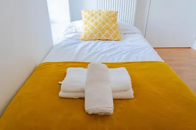 Un ou plusieurs lits dans un hébergement de l'établissement La Pause Péronnaise - Maison de ville en coeur de village