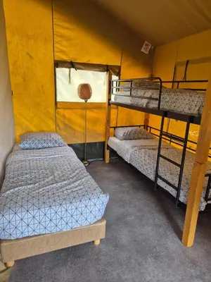 Un ou plusieurs lits dans un hébergement de l'établissement La Bedure