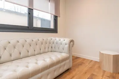Coin salon dans l'établissement Le Pied à Terre de Montcenis - Appt avec parking privé