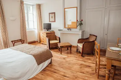 Un ou plusieurs lits dans un hébergement de l'établissement Appart Hotel Charles Sander