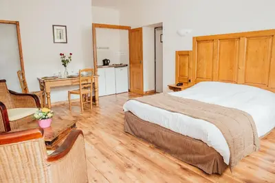 Un ou plusieurs lits dans un hébergement de l'établissement Appart Hotel Charles Sander