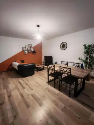 Coin salon dans l'établissement Appartement Cosy