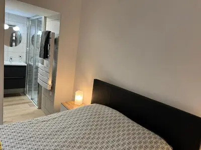 Un ou plusieurs lits dans un hébergement de l'établissement Appartement Cosy
