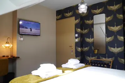 Un ou plusieurs lits dans un hébergement de l'établissement Chambres d'Hôtes La mésange à tête Bleue