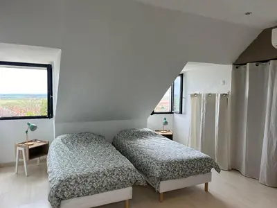 Un ou plusieurs lits dans un hébergement de l'établissement La maison du chêne