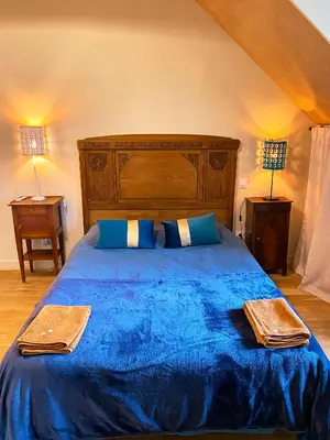 Un ou plusieurs lits dans un hébergement de l'établissement Gîte de la maison jaune - Comblanchien