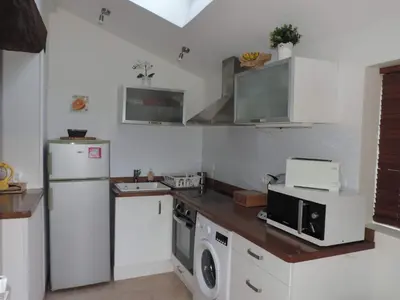 Cuisine ou kitchenette dans l'établissement Au doux pays d Alésia