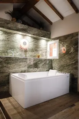 Salle de bains dans l'établissement Appart hôtel le 8 La Suite & Spa - parking gratuit -