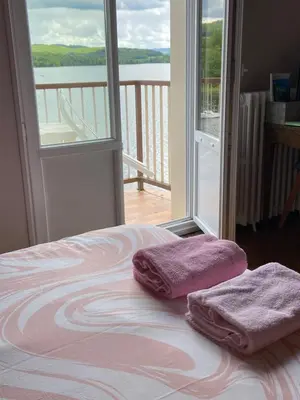 Un ou plusieurs lits dans un hébergement de l'établissement LES TERRASSES DU LAC