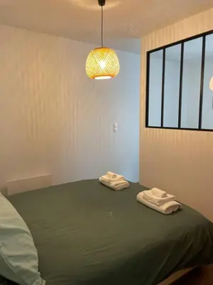 Un ou plusieurs lits dans un hébergement de l'établissement La maison douce