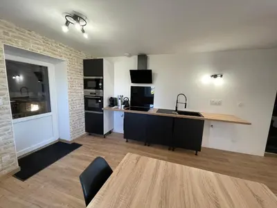 Cuisine ou kitchenette dans l'établissement Le Clos des Cadots - Suites équipées