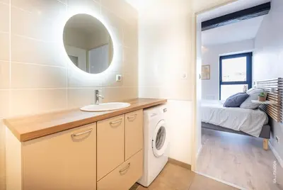Un ou plusieurs lits dans un hébergement de l'établissement Appartement T2 climatisé Le quai 391
