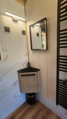 Télévision ou salle de divertissement dans l'établissement Lodge du Château de Feschaux