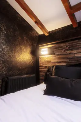 Un ou plusieurs lits dans un hébergement de l'établissement Appart hôtel le 8 La Suite - parking gratuit -