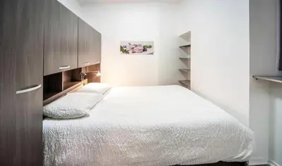 Un ou plusieurs lits dans un hébergement de l'établissement Appartement cosy Hyper centre
