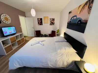 Un ou plusieurs lits dans un hébergement de l'établissement Appartement Chalon