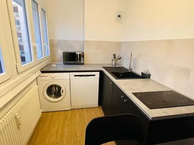 Cuisine ou kitchenette dans l'établissement Appartement Chalon