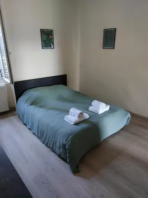 Un ou plusieurs lits dans un hébergement de l'établissement Appartement cosy tout confort