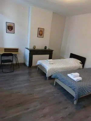 Un ou plusieurs lits dans un hébergement de l'établissement Appartement cosy tout confort