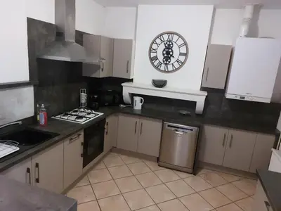 Cuisine ou kitchenette dans l'établissement Appartement cosy tout confort