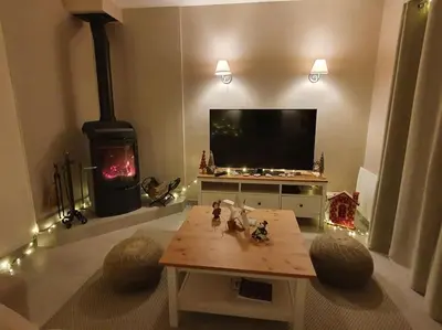 Télévision ou salle de divertissement dans l'établissement Gite de Charme des 3 Allures