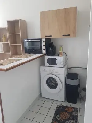 Cuisine ou kitchenette dans l'établissement Studio lumineux centre-ville
