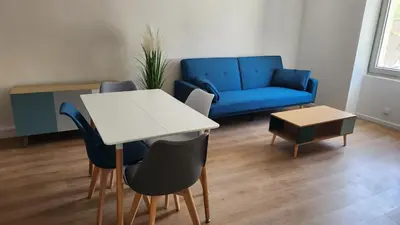 Coin salon dans l'établissement Appartement tout confort vue sur les forts