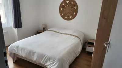 Un ou plusieurs lits dans un hébergement de l'établissement Appartement tout confort vue sur les forts