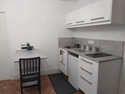 Cuisine ou kitchenette dans l'établissement Le cosy