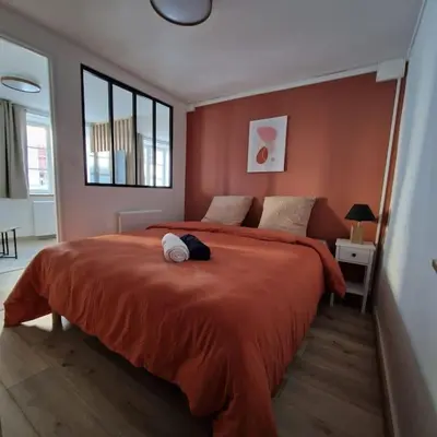 Un ou plusieurs lits dans un hébergement de l'établissement Studio Rue Carnot Le St Pierre