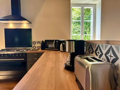 Cuisine ou kitchenette dans l'établissement La Forge