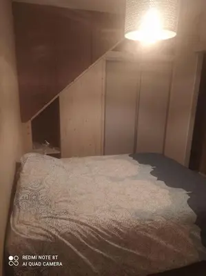 Un ou plusieurs lits dans un hébergement de l'établissement Charmant Appartement 2 pièces avec extérieur