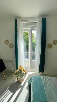 Un ou plusieurs lits dans un hébergement de l'établissement Cosy au Cœur de Dijon