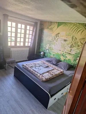 Un ou plusieurs lits dans un hébergement de l'établissement Maison au milieu des vignes