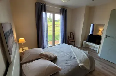 Un ou plusieurs lits dans un hébergement de l'établissement Appartement La pierre de bresse