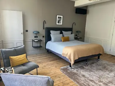 Un ou plusieurs lits dans un hébergement de l'établissement L'Hotel Particulier