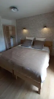 Un ou plusieurs lits dans un hébergement de l'établissement Chez Flo