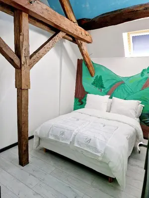 Un ou plusieurs lits dans un hébergement de l'établissement Maison cosy piscine jacuzzi sauna