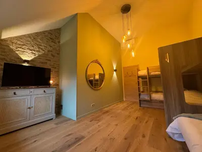 Un ou plusieurs lits dans un hébergement de l'établissement Le Clos de la Chapelle
