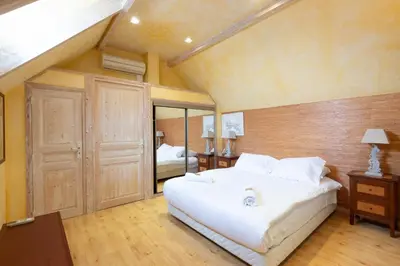 Un ou plusieurs lits dans un hébergement de l'établissement Le Clos des Vignes
