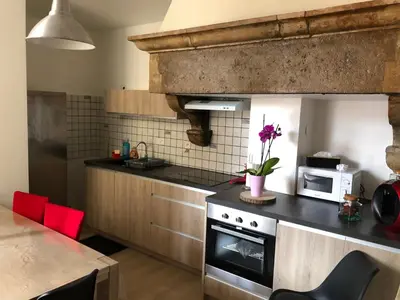 Cuisine ou kitchenette dans l'établissement Au passage
