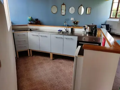 Cuisine ou kitchenette dans l'établissement Le Puits du Bonheur