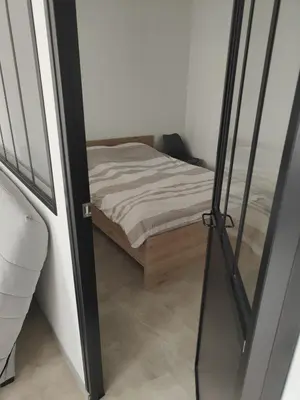 Un ou plusieurs lits dans un hébergement de l'établissement Maisonnette - Charme Cœur de Vigne