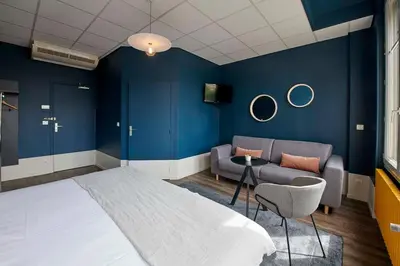 Un ou plusieurs lits dans un hébergement de l'établissement Hôtel de France - Beaune