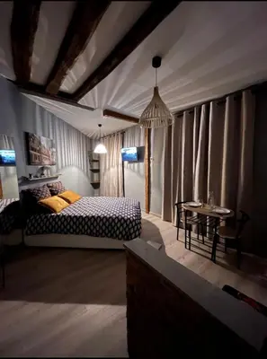 Un ou plusieurs lits dans un hébergement de l'établissement Studio cosy, cité gastronomique